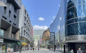 Modern street with shops and buildings.