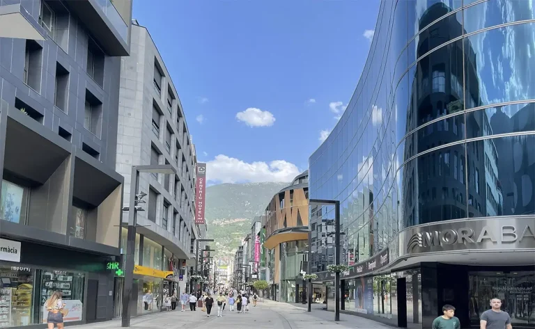 Modern street with shops and buildings.